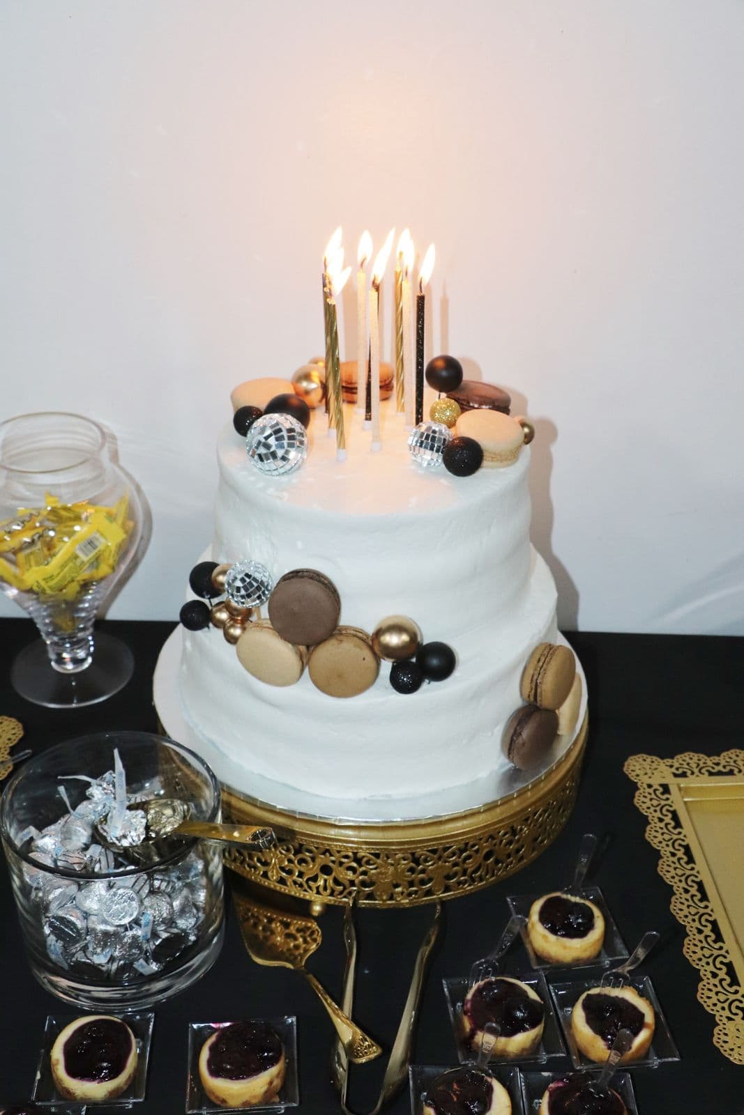 Tiered celebration cake finished with gold accents
