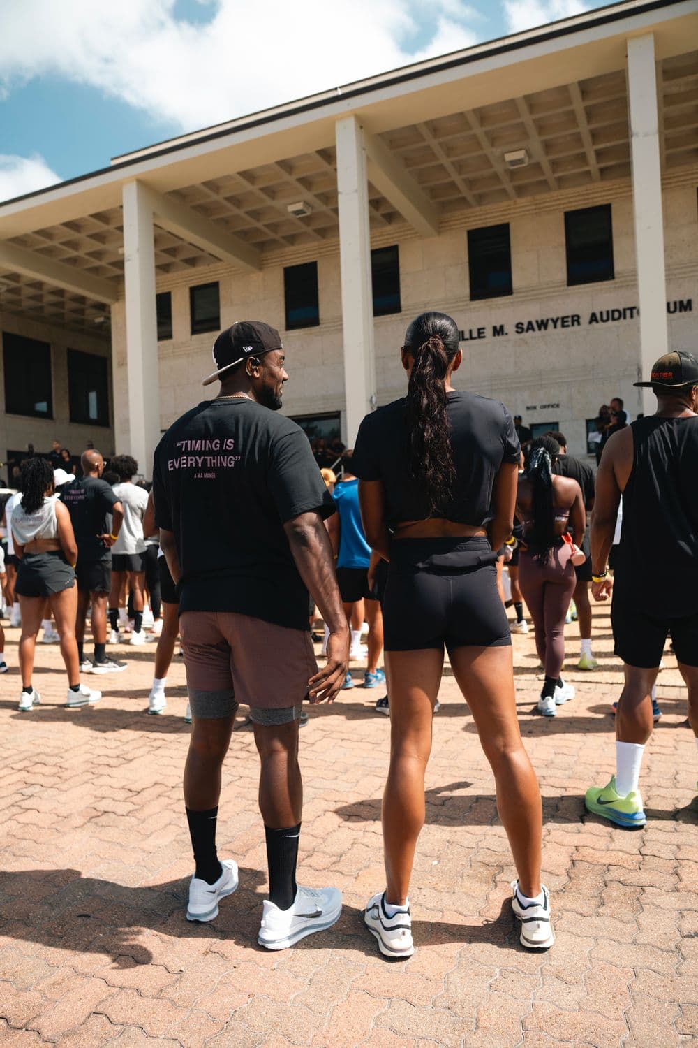 Run club gathering outside the Sawyer Auditorium