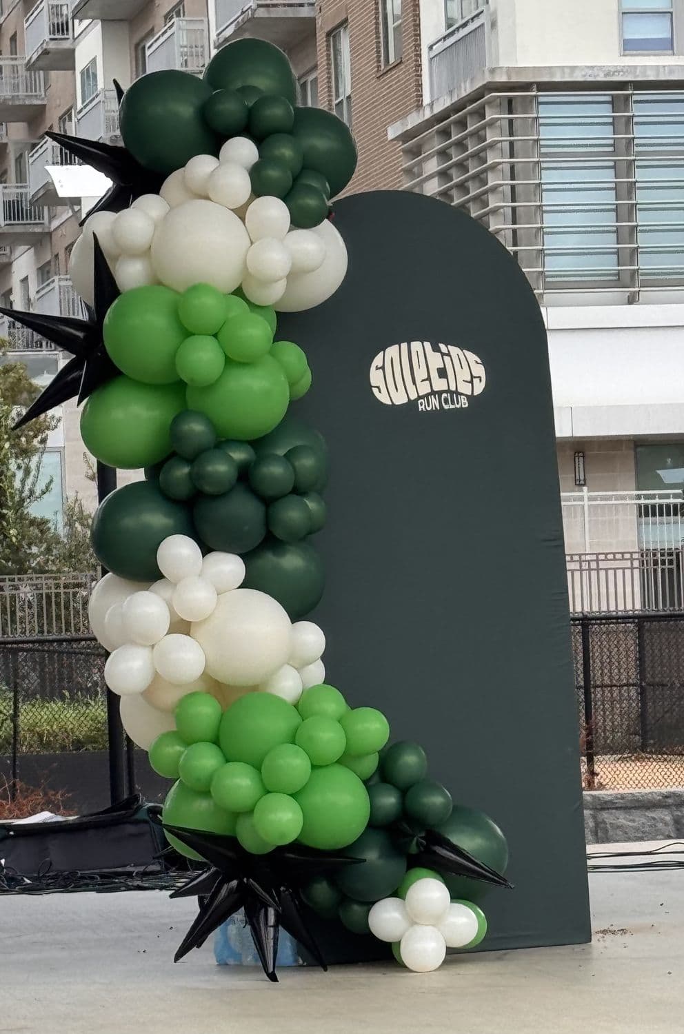 SoleTies Run Club arched balloon backdrop