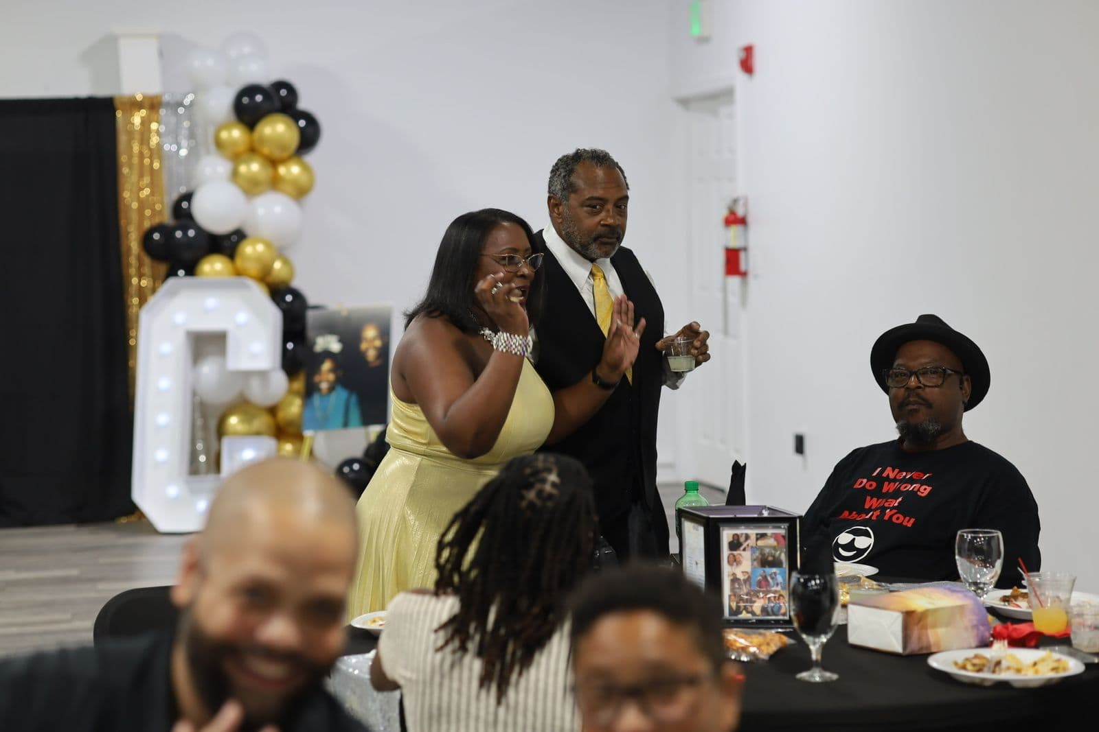 Host addressing guests during a nonprofit gala